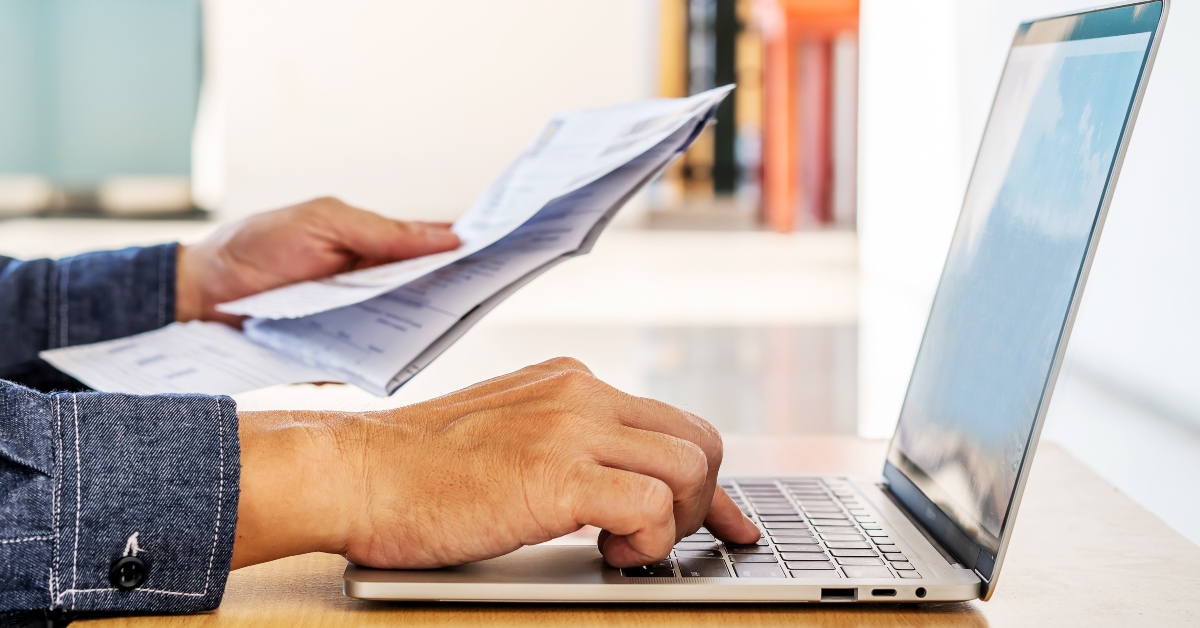 businessman checking a typed report