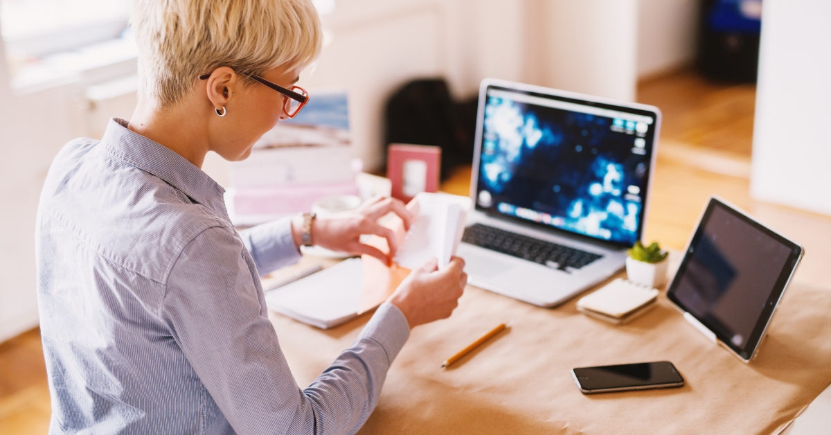 woman designer putting a letter