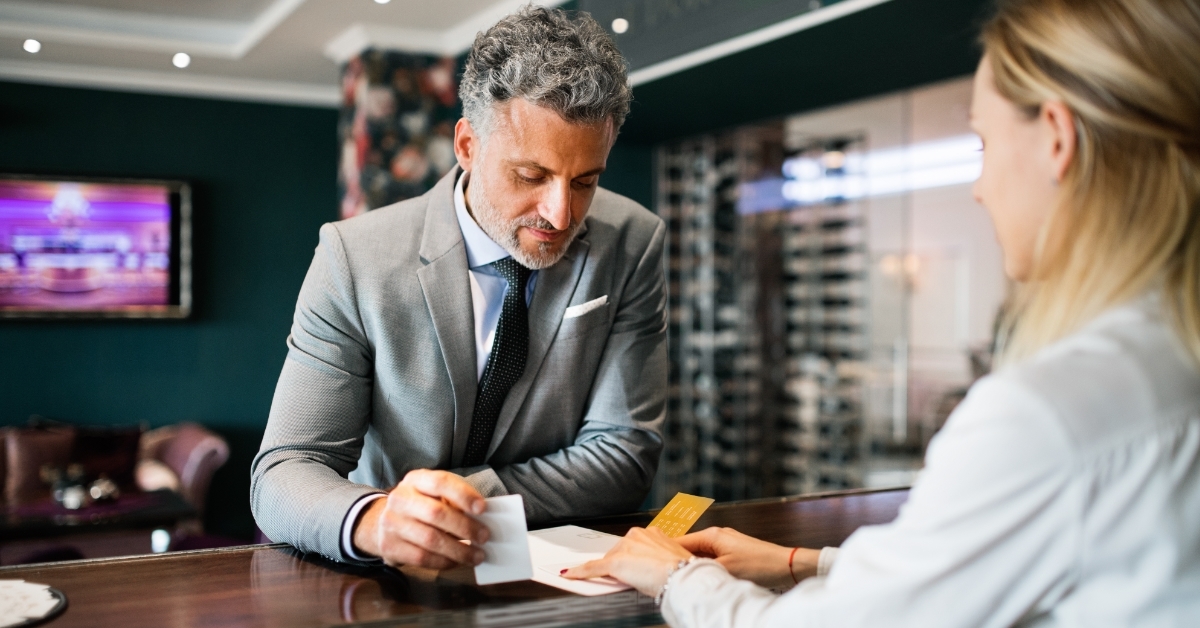 Mature businessman at hotel reception