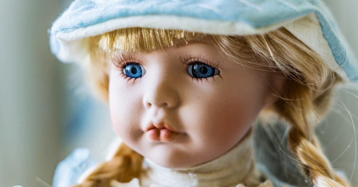 porcelain doll with blond hair