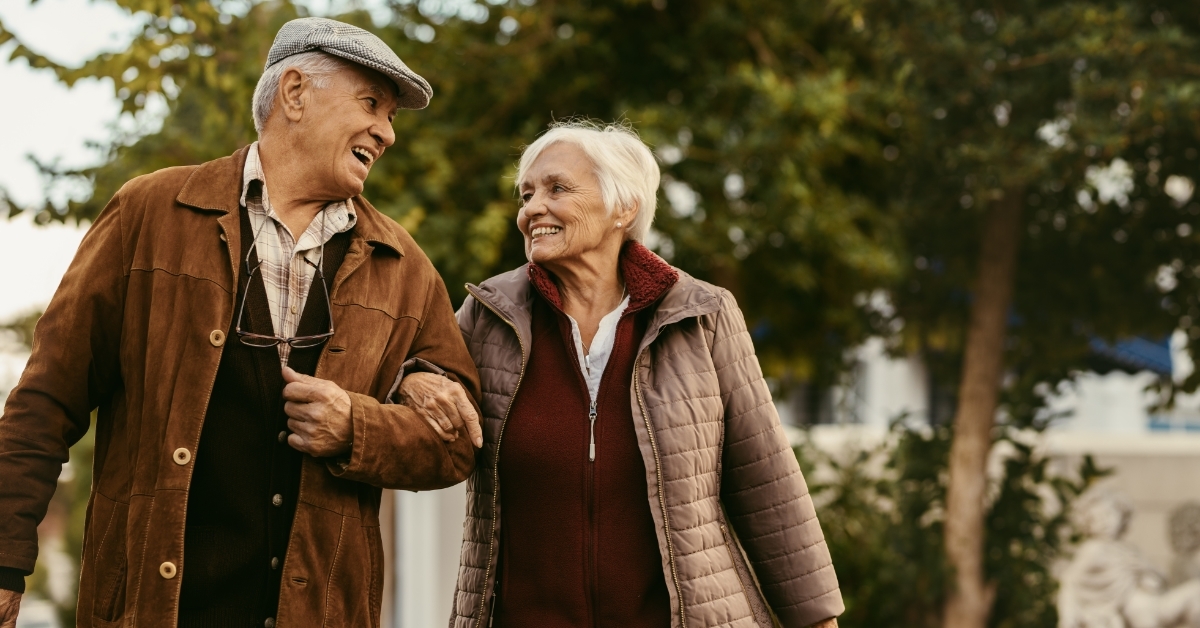 senior couple in park during winter