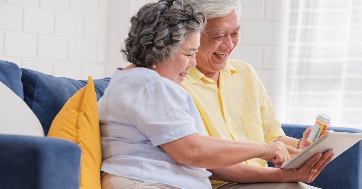 asian senior couple use tablet