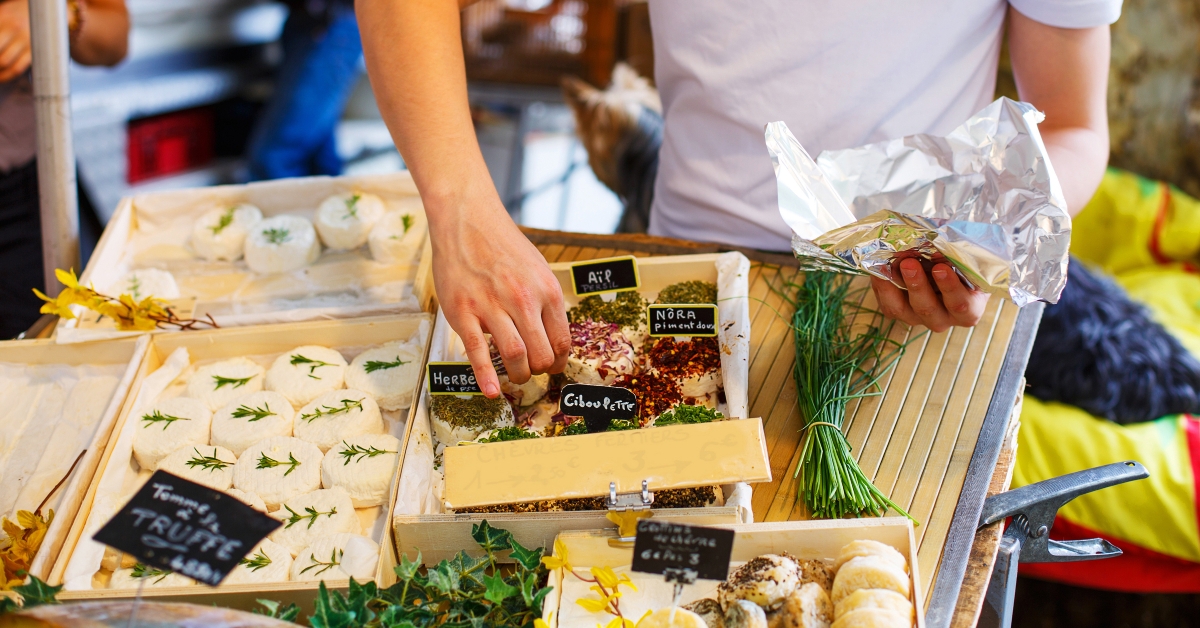 selling cheese on market place