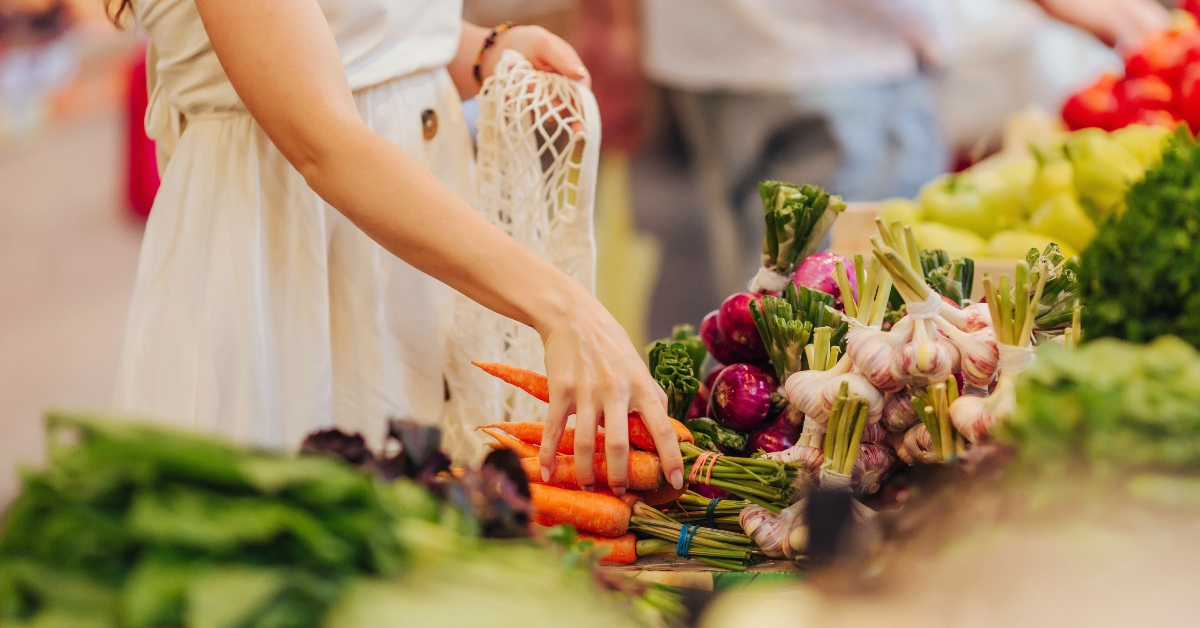 woman puts fruits and vegetables