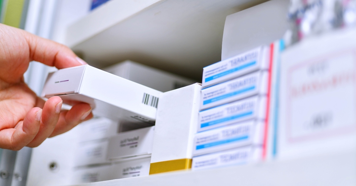 pharmacist hand holding medicine box
