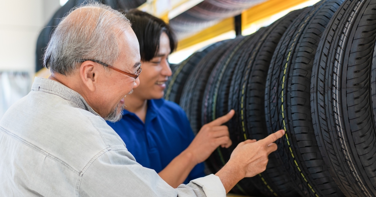 man choosing wheel tires