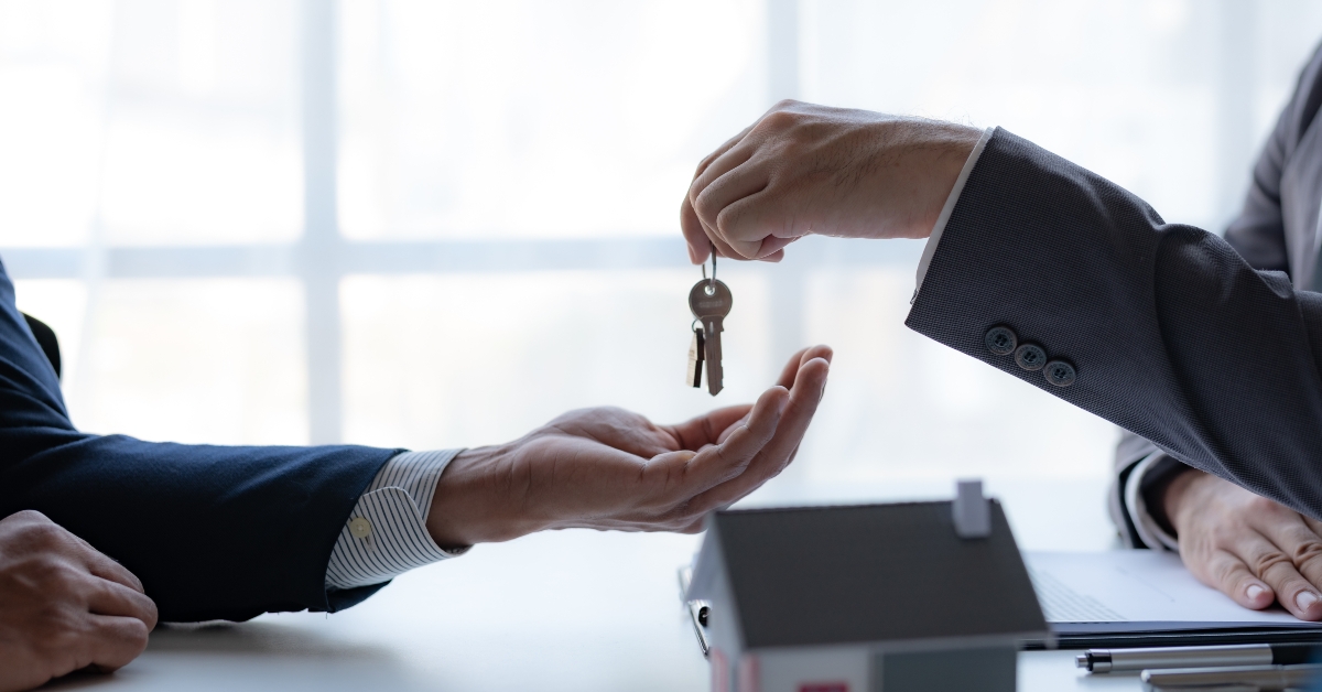 real estate agent handing