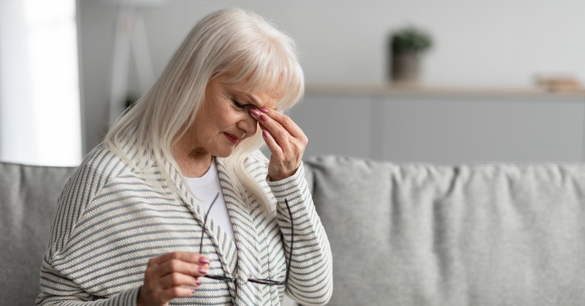 mature woman rubbing her eyes