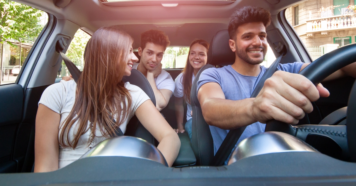 group of friends sharing car