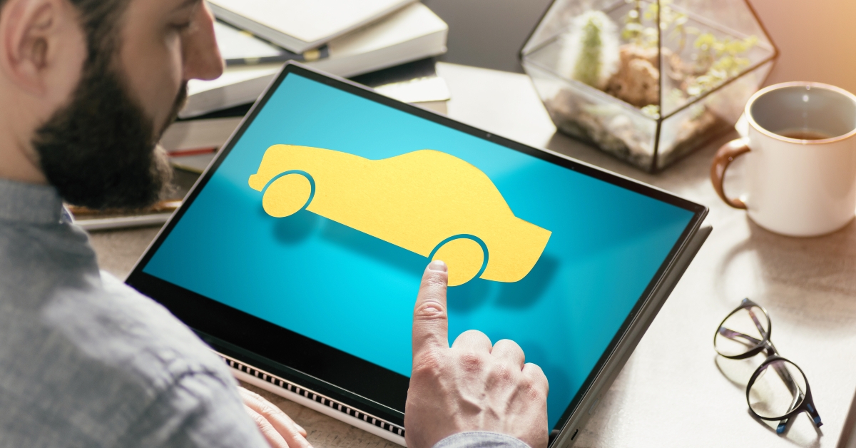 man presses on car icon