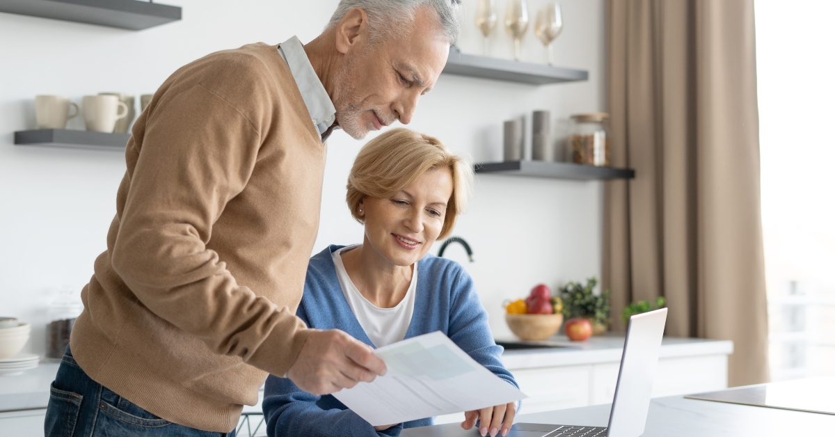 aged couple checking finance account