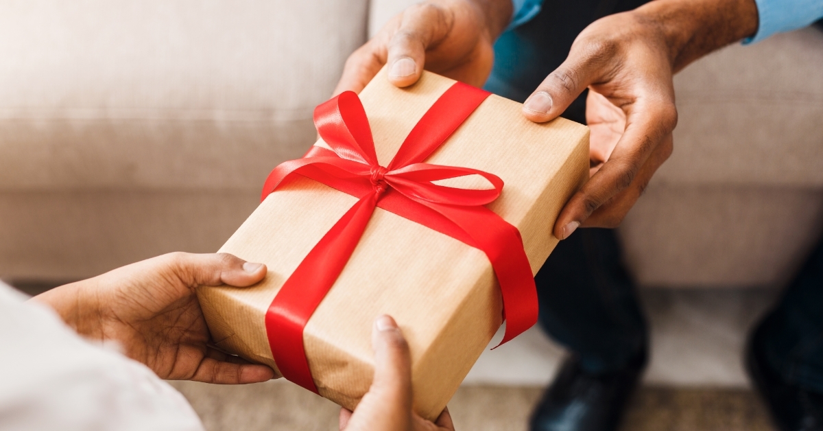 Father giving gift to daughter