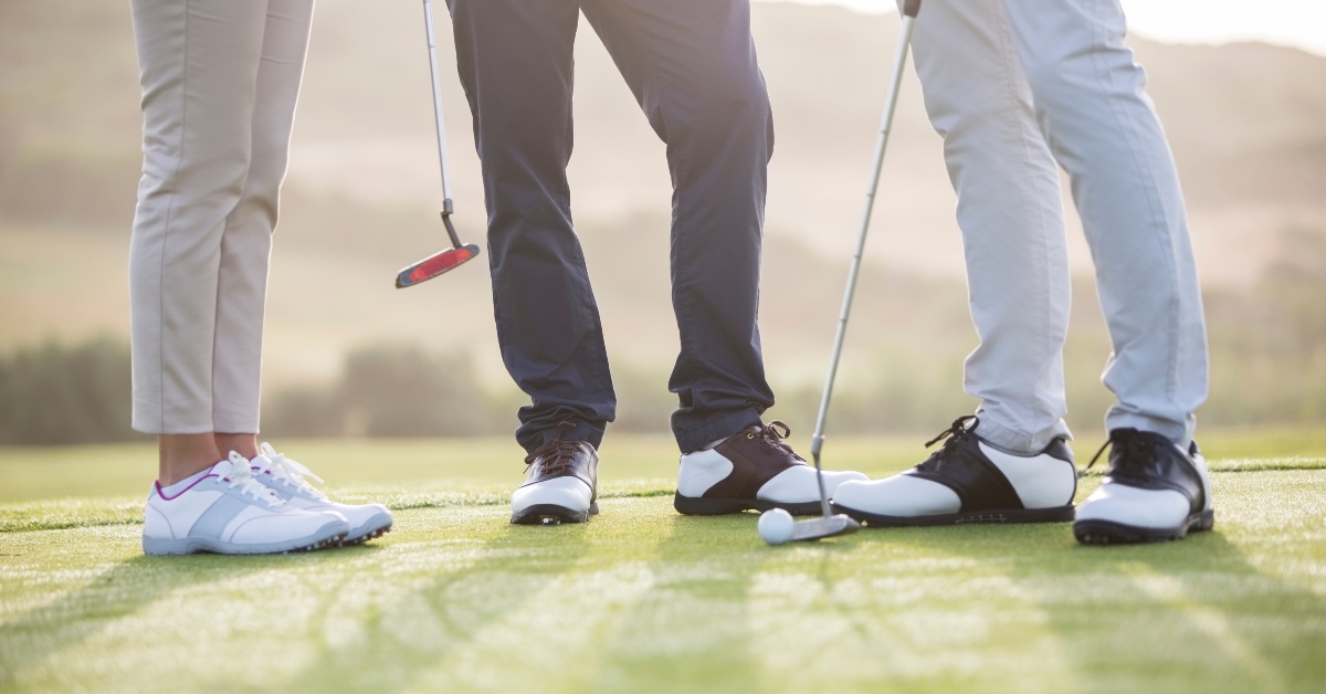 friends standing on golf course