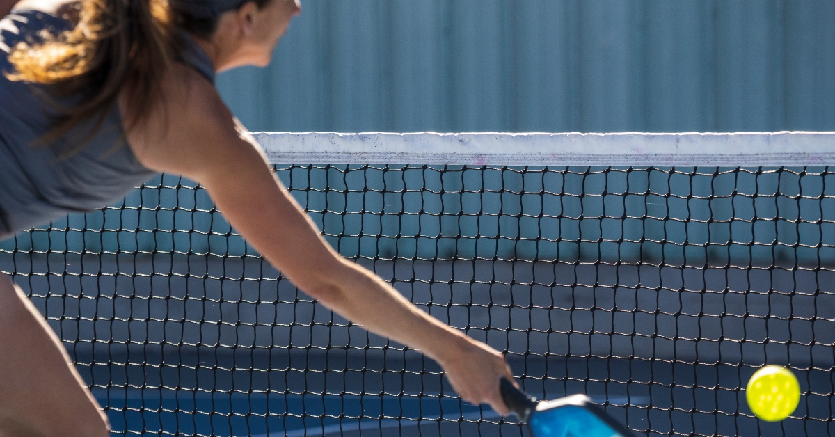people playing pickleball outdoors