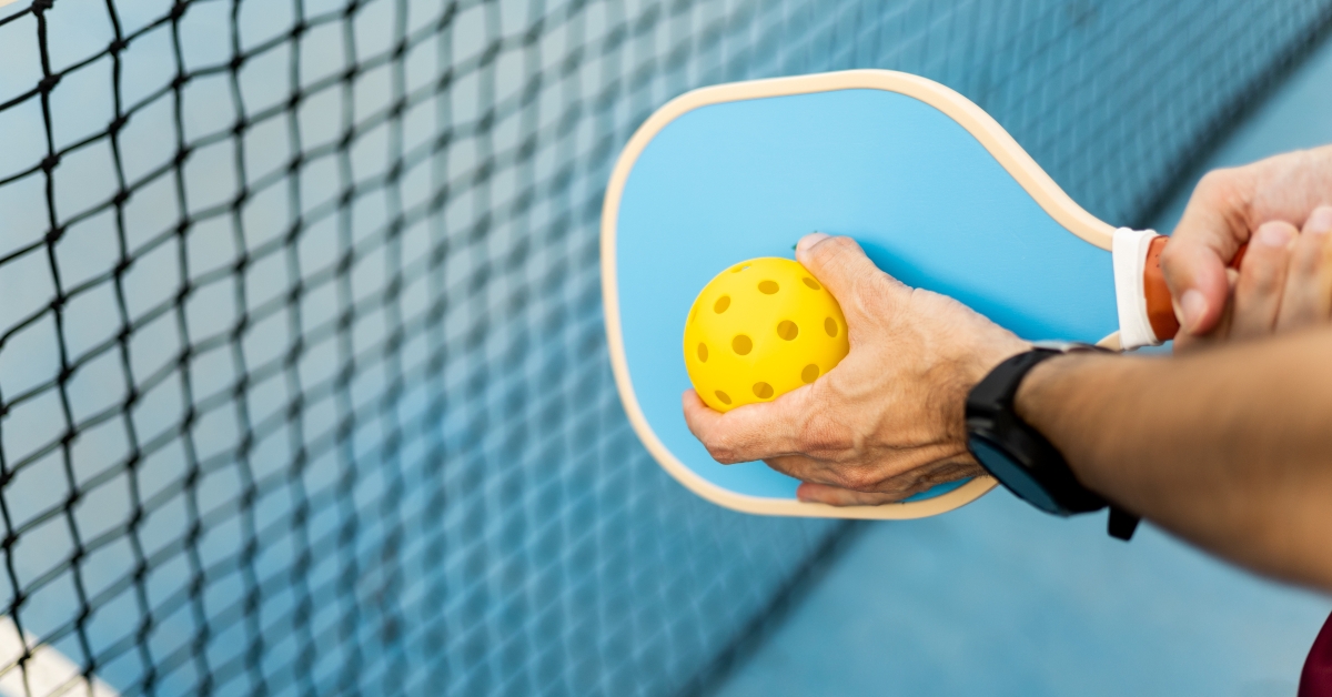 pickleball racket and a ball