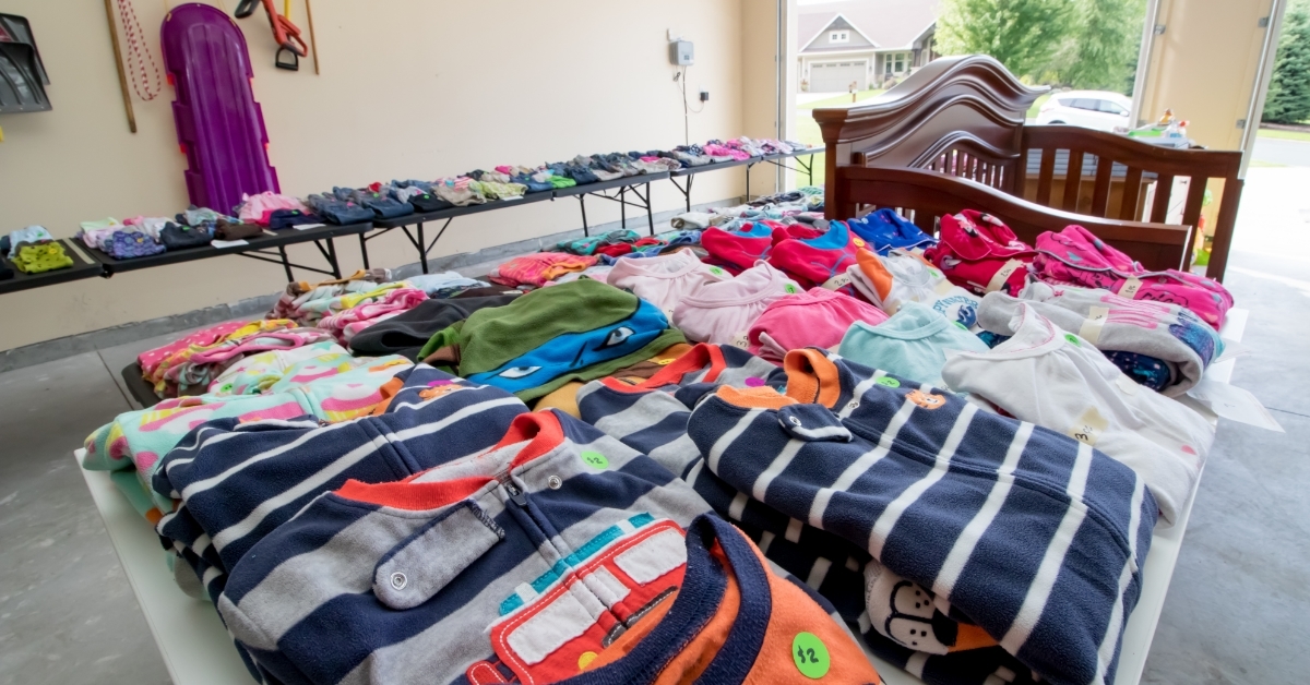 children clothes and toys at garage sale