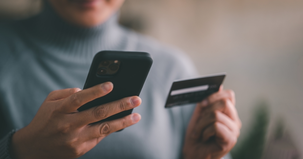 woman using smartphone to shop online