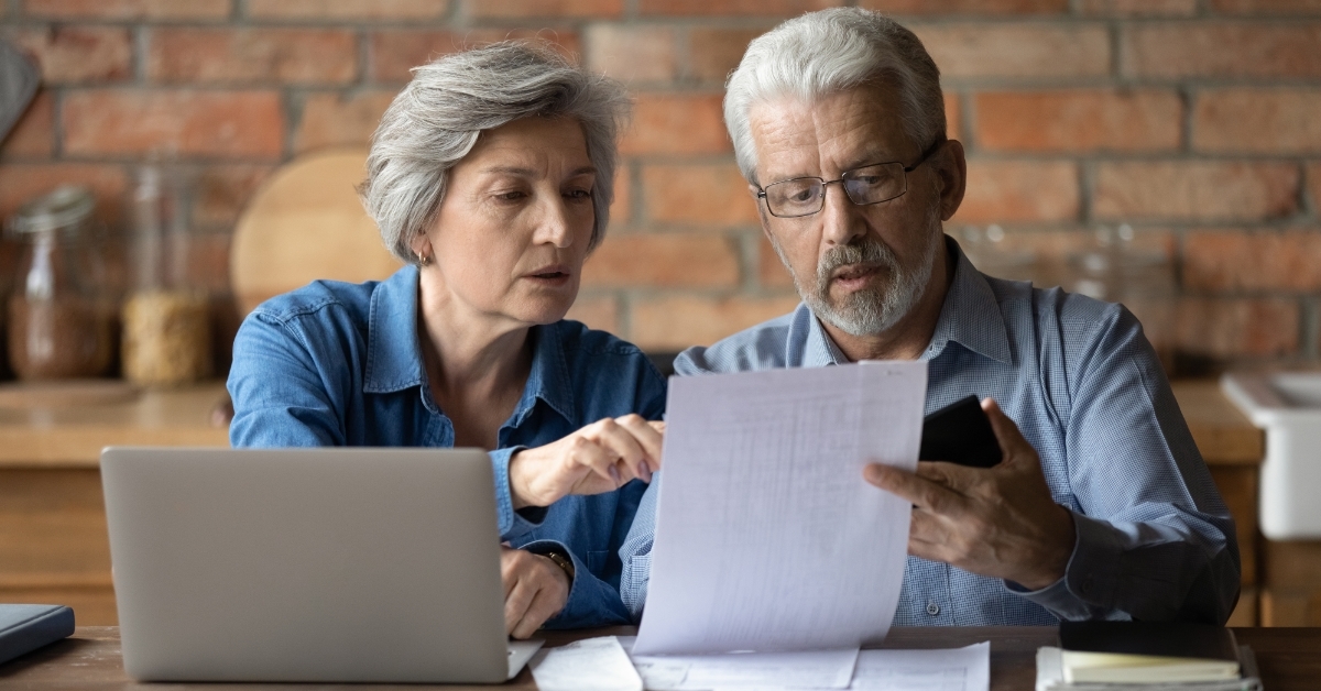 senior couple reviewing domestic bills