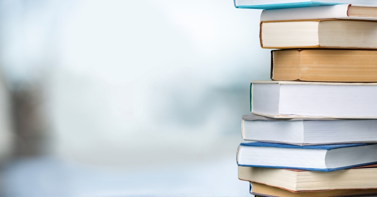 pile of books on table