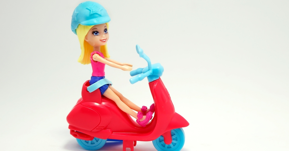 polly pocket on motorcycle scooter