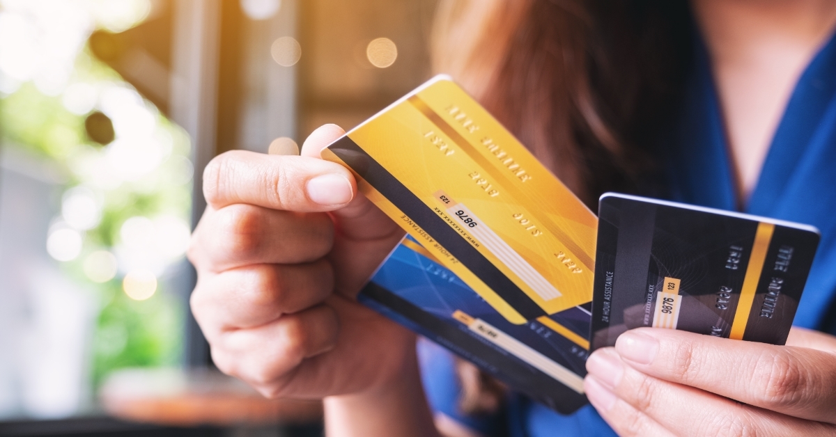 woman choosing credit card to use