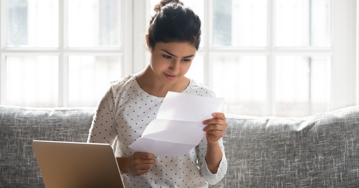 woman reading paper letter