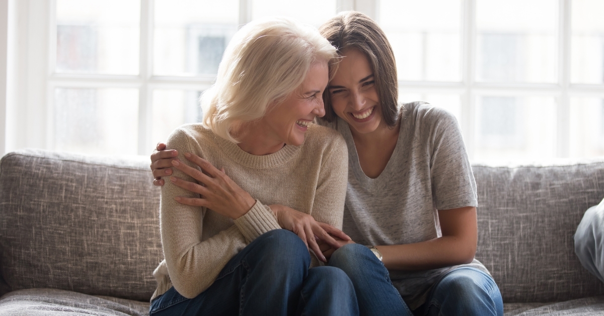 mother and daughter laughing together
