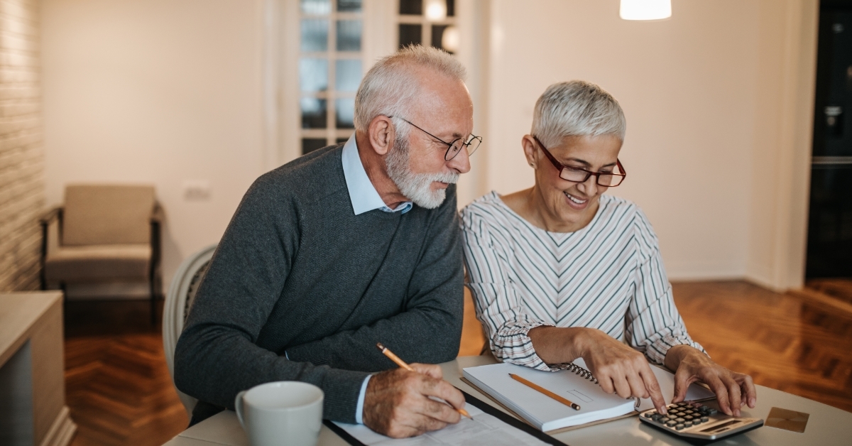 senior couple reviewing bills together 