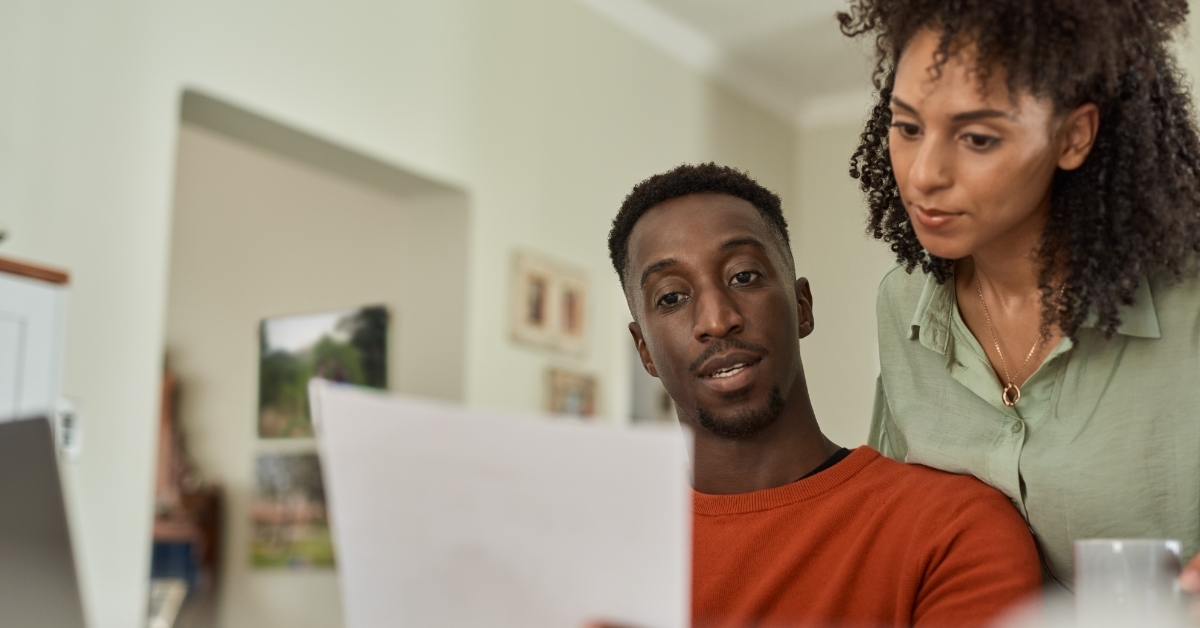 african American couple reviewing bills together