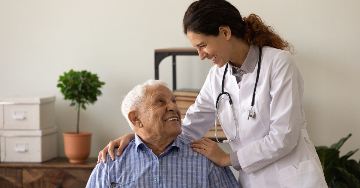 doctor supporting senior patient