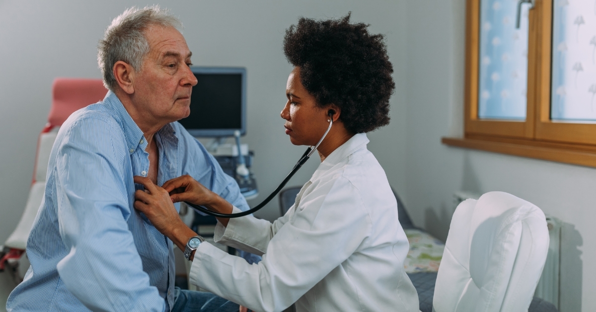 Female doctor examining senior patient