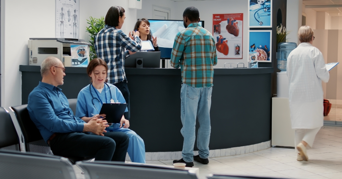 hospital reception desk with diverse people