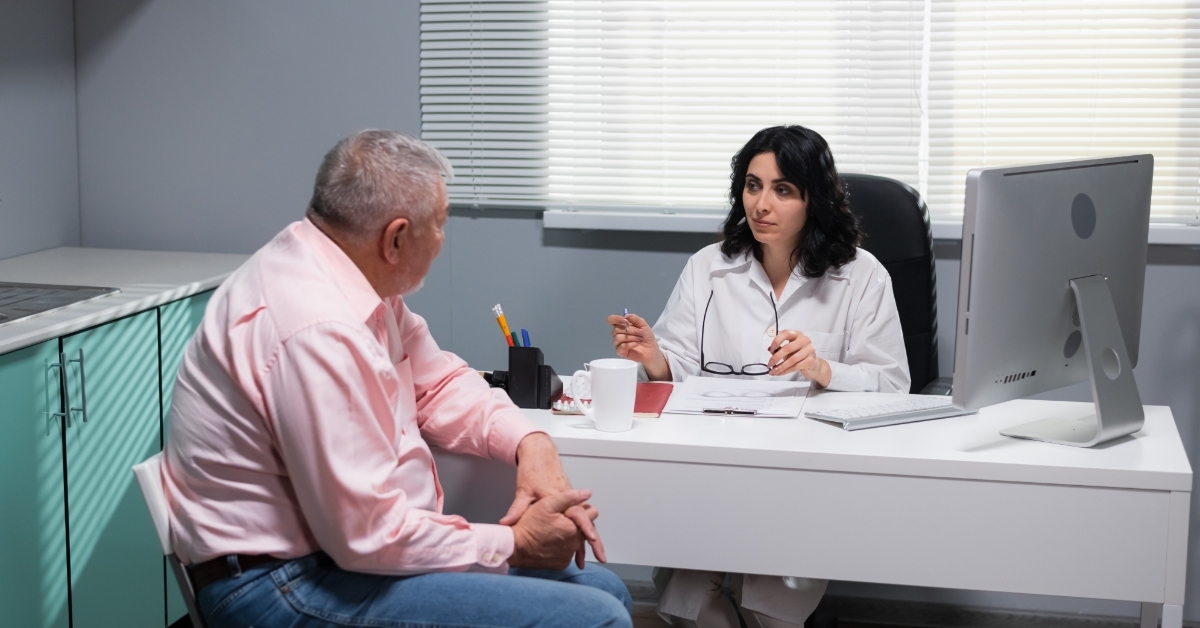 senior patient consulting female doctor