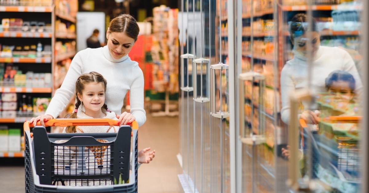Mother with daughter at grocery store