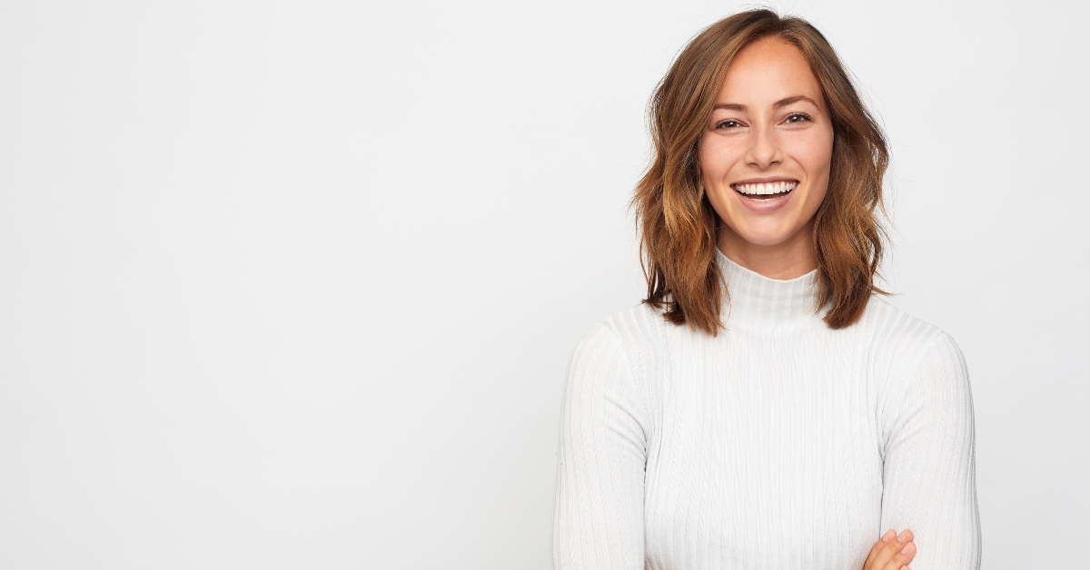 happy woman looks in camera