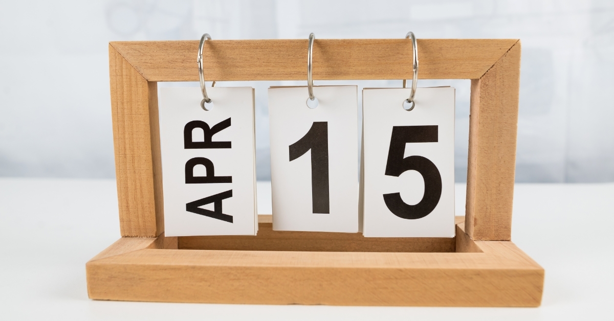 April 15 wooden calendar on table