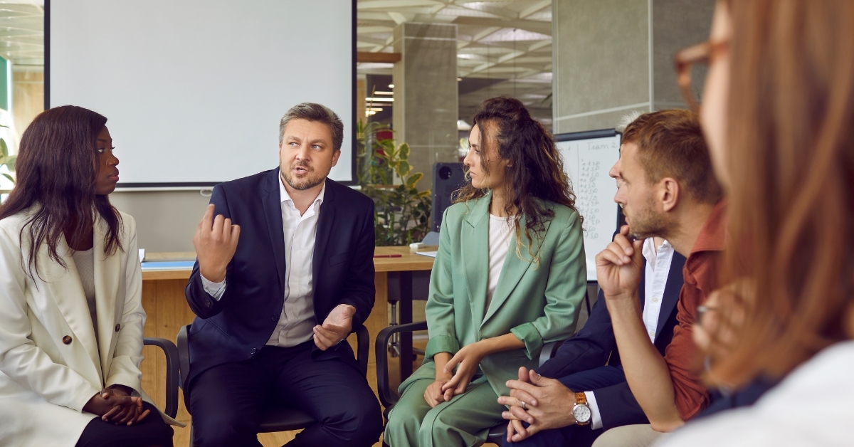 business team meeting with professional coach