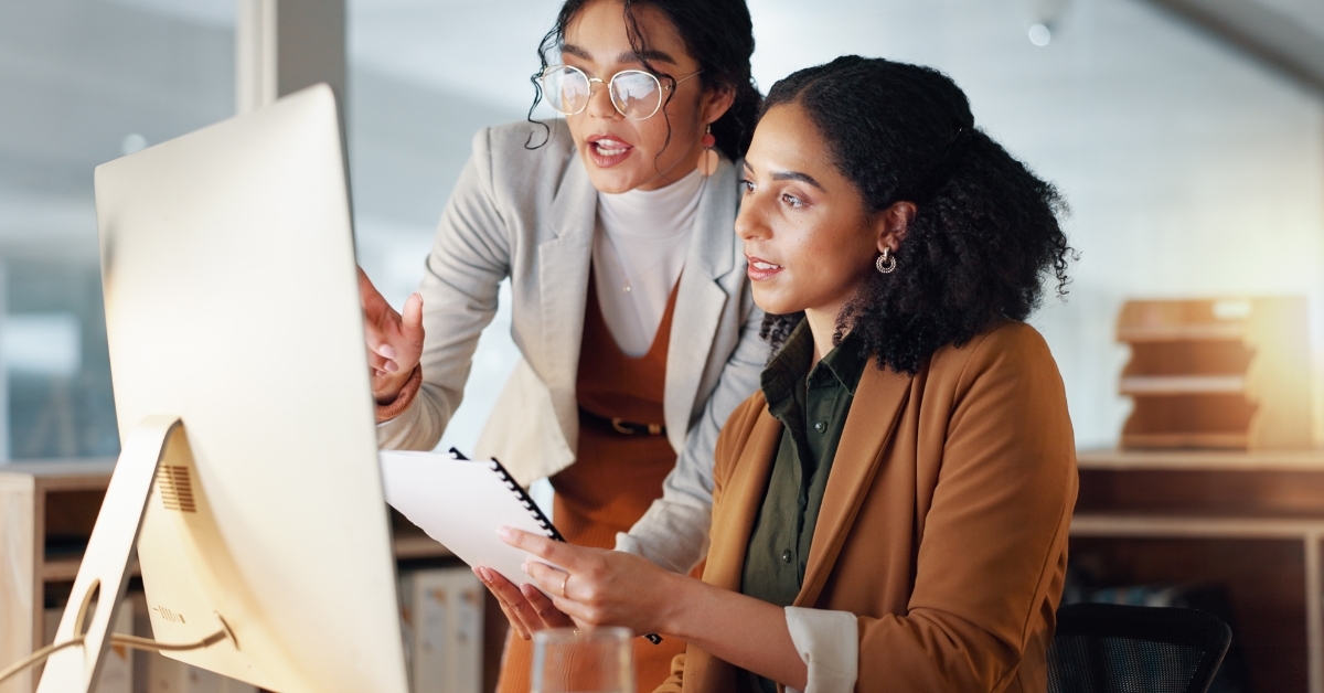 business women discussing project together