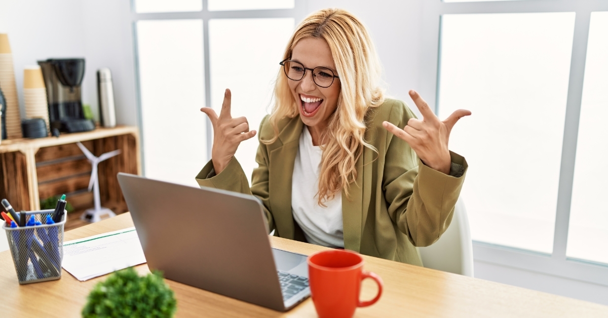 excited business woman working at office