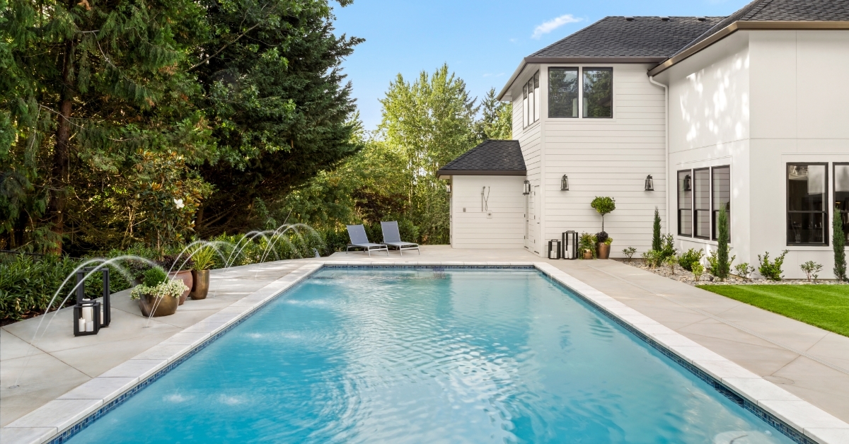 home exterior with large swimming pool 
