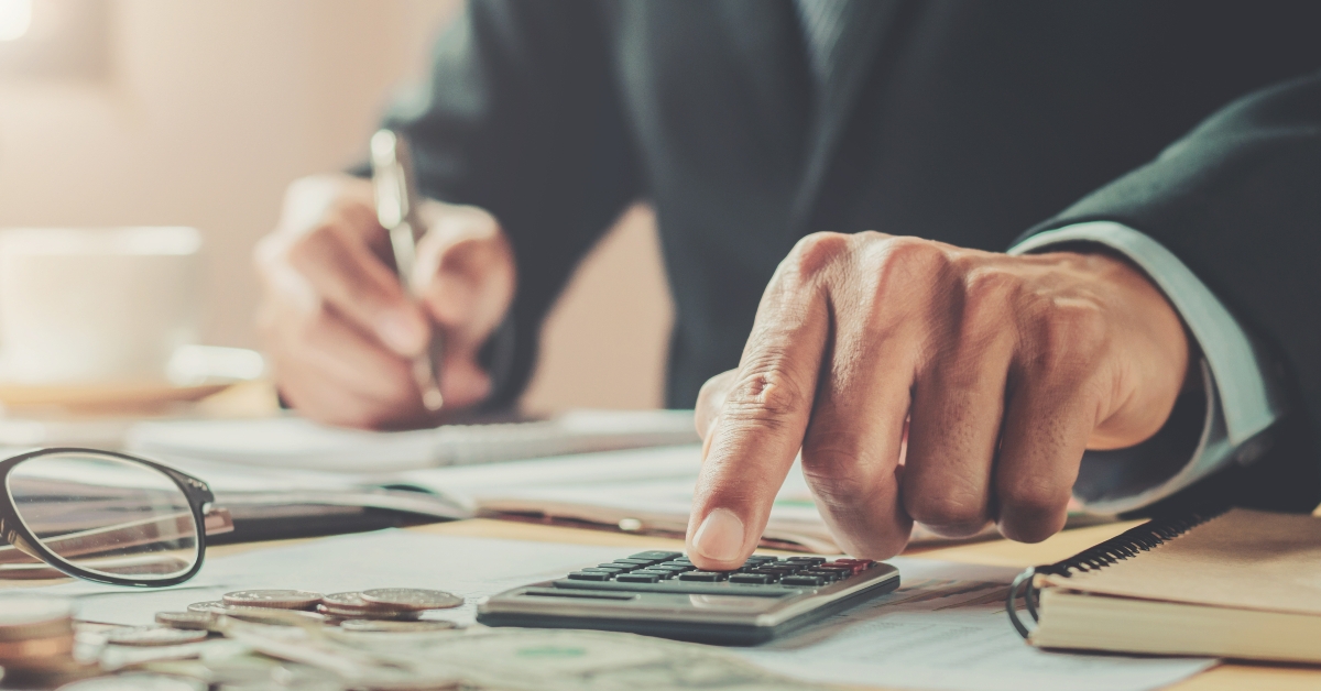 accountant using calculator