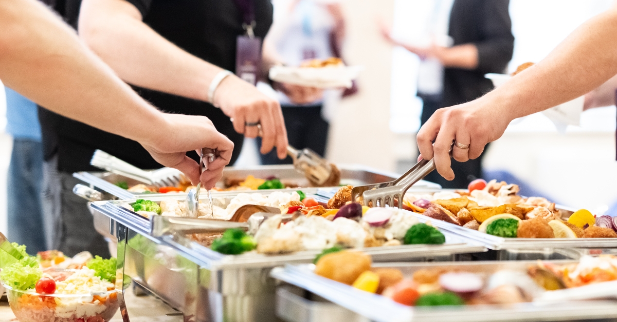 picking up food from buffet