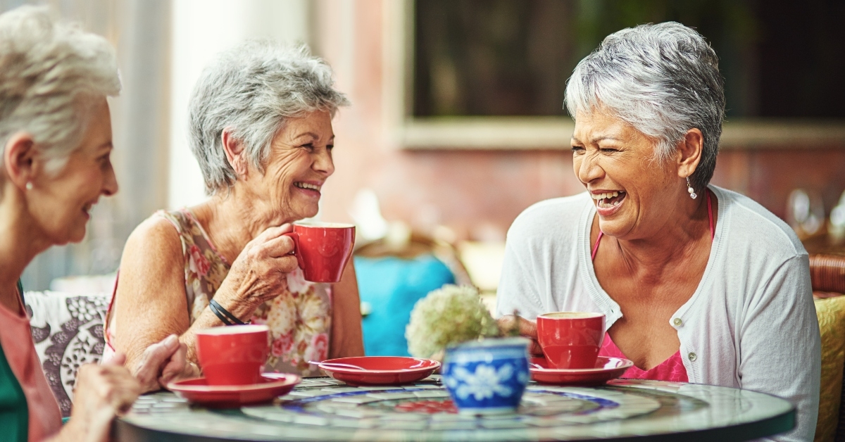 senior female friends drinking coffee