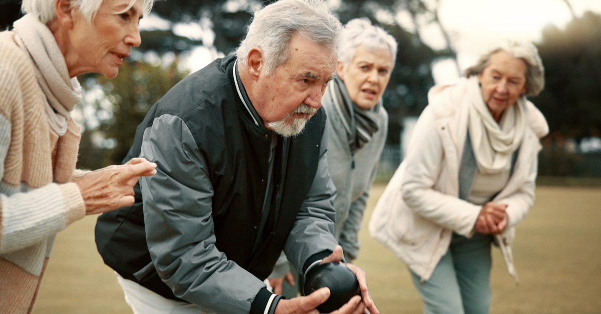 senior people bowling in nature