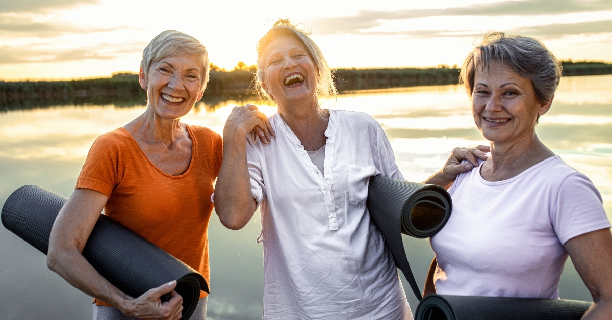 senior woman with yoga mats 