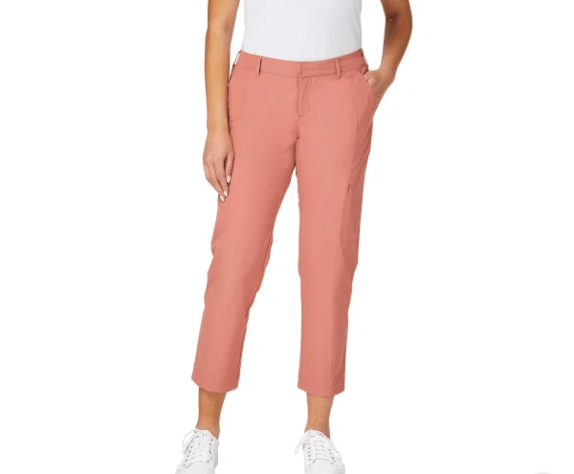 bottom of lady wearing coral pants and white top
