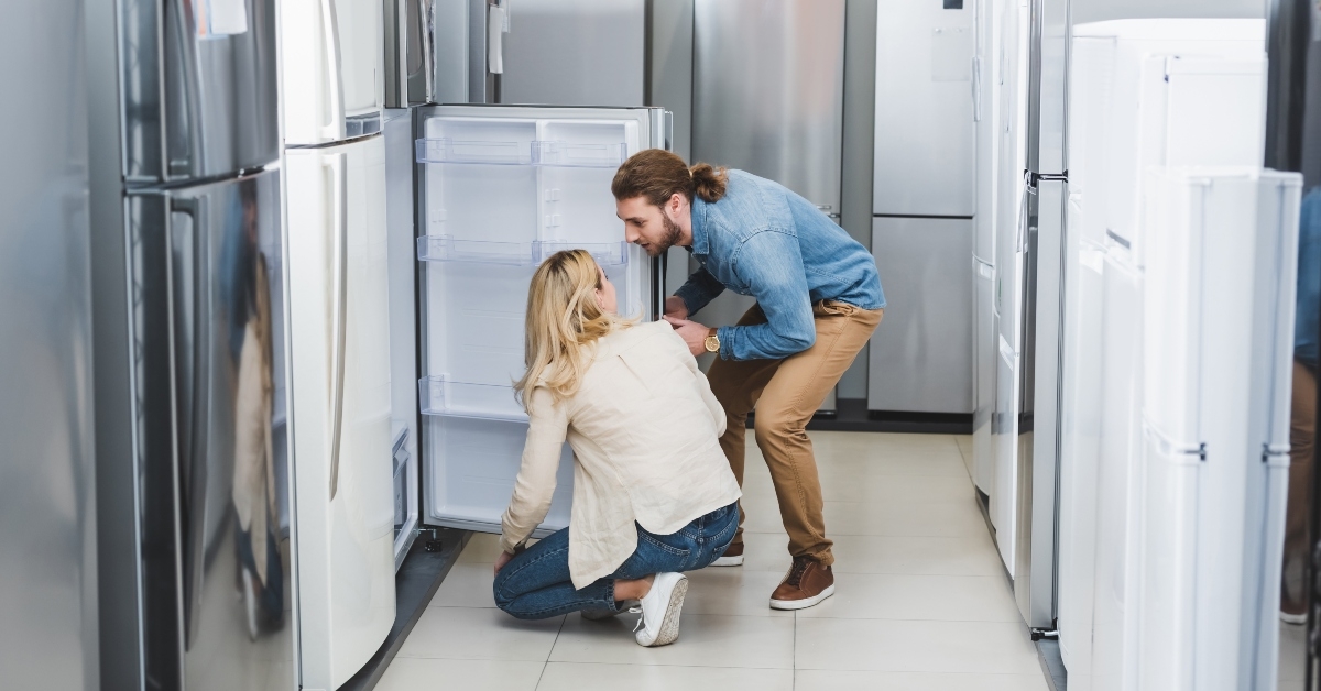 couple talking near fridge