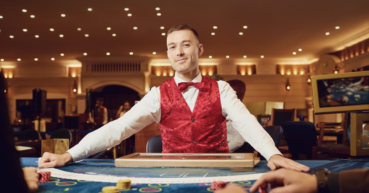croupier holds poker cards