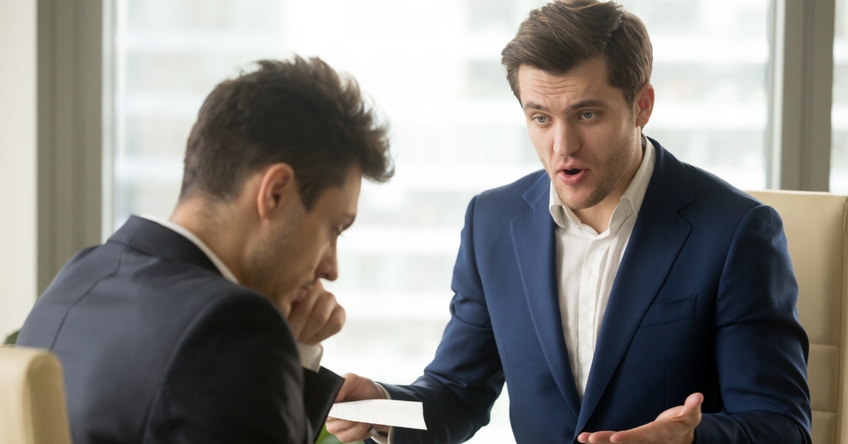 Angry male boss yelling at employee