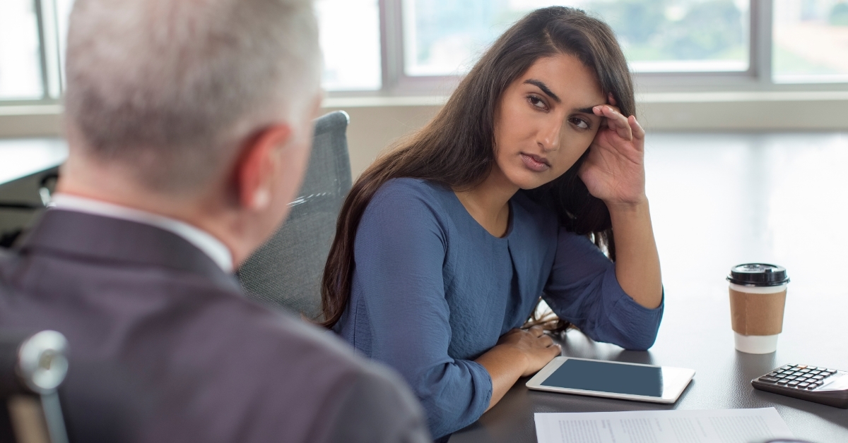 Business leader instructing female assistant